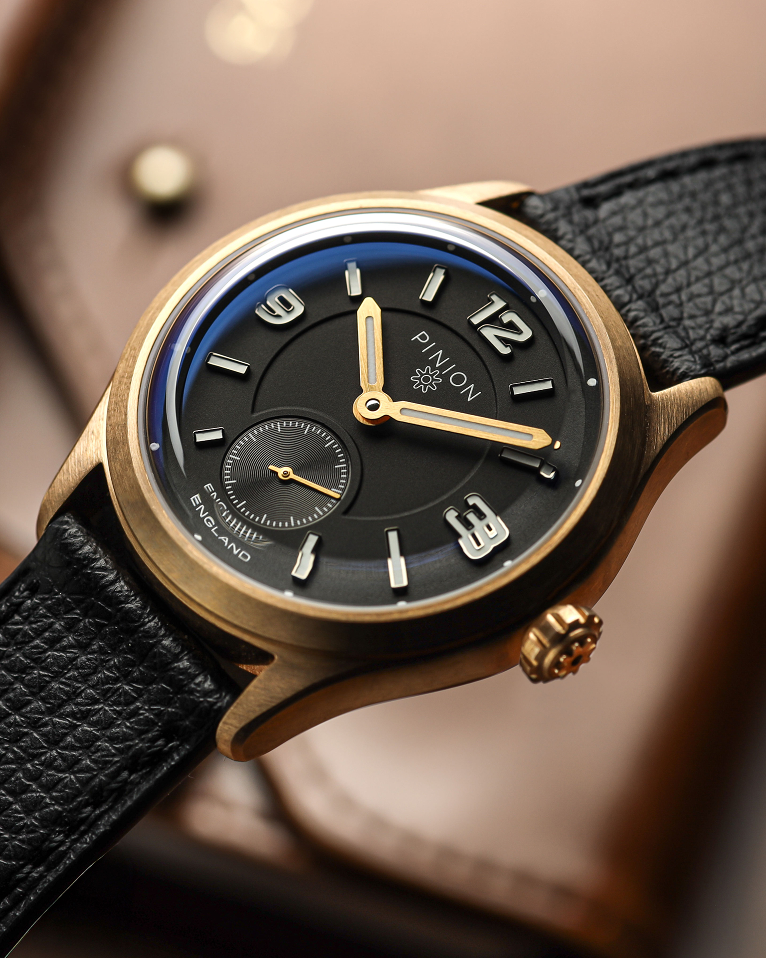Pinion Pure - A 38mm bronze handwound watch with black dial
