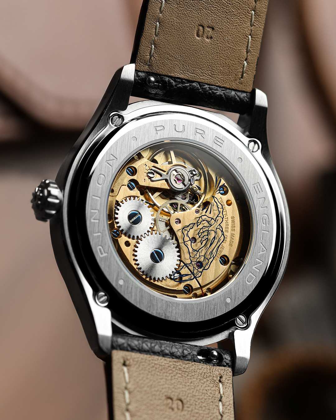 Pinion Pure caseback with handwound Swiss Sellita SW261-1 M movement in gilt finish